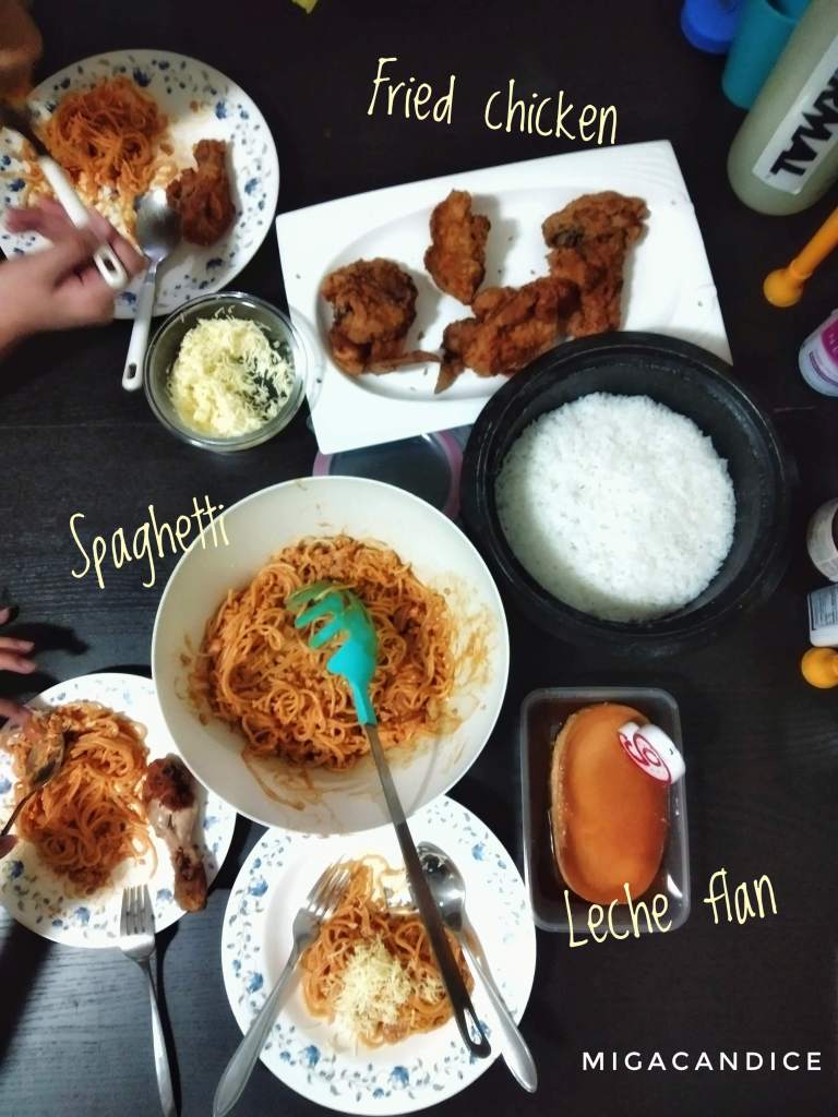 simple birthday dinner with spaghetti, fried chicken and leche flan